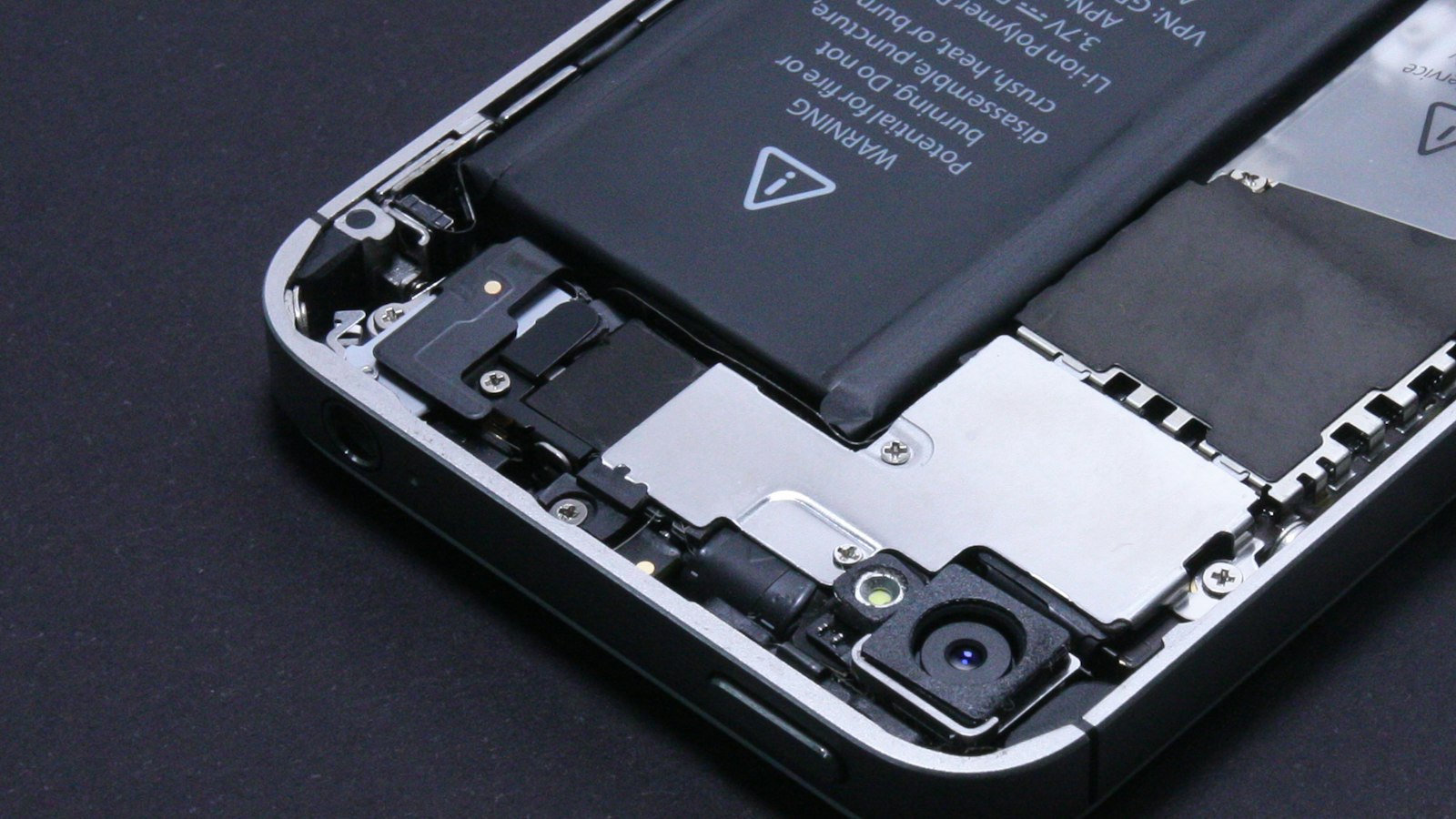 Opened iPhone showing the battery inside