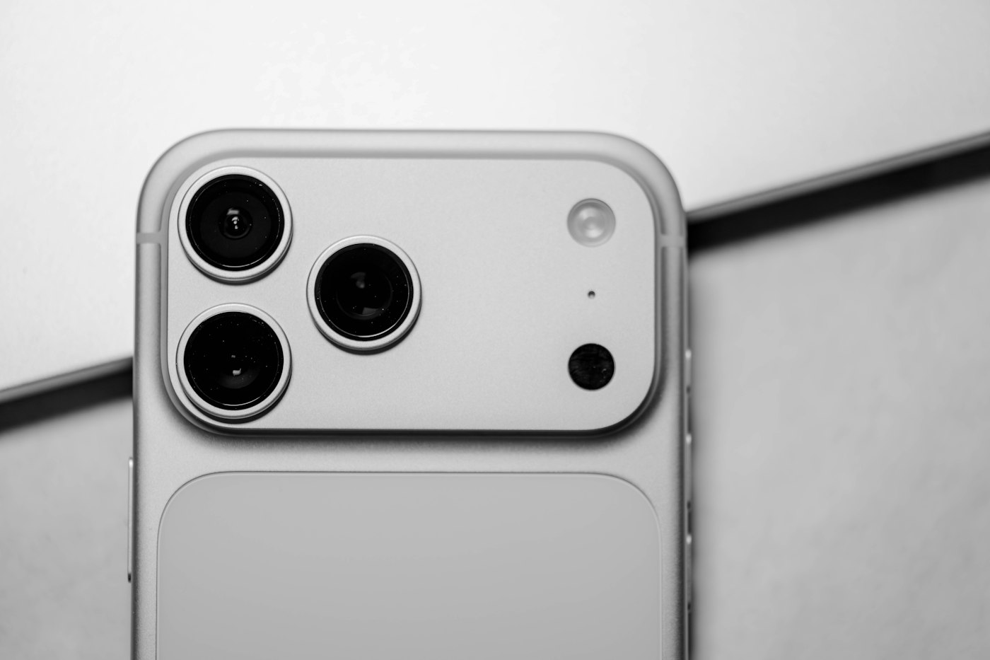 Close-up of the camera on a modern silver iPhone Pro